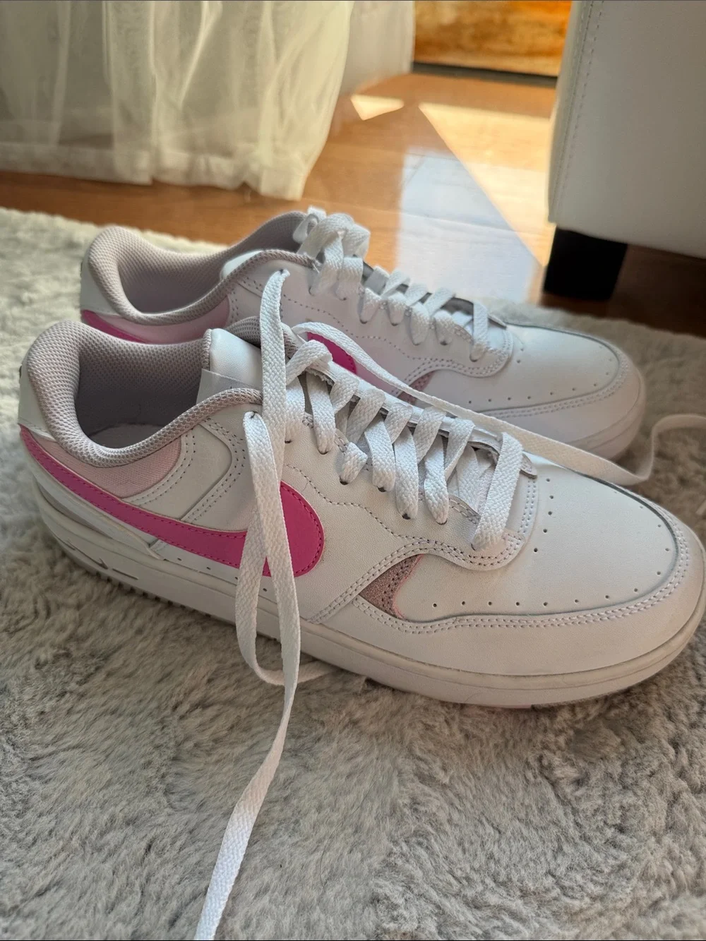 Nike Women's White Sneakers with Pink Swoosh